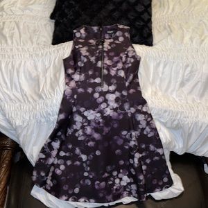 DKNY dress in size 4. Medium length. White dots with purple background.
